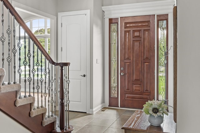 entrance foyer with light tile patterned flooring