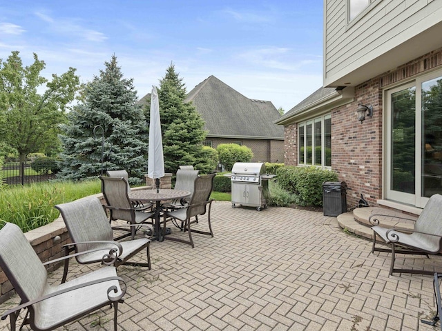 view of patio featuring a grill