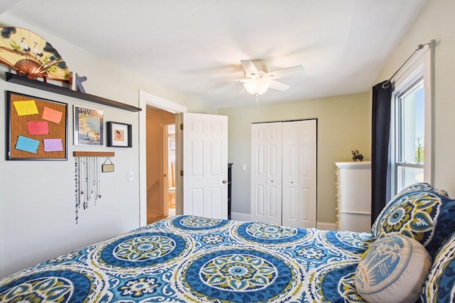bedroom with baseboards, a closet, and ceiling fan