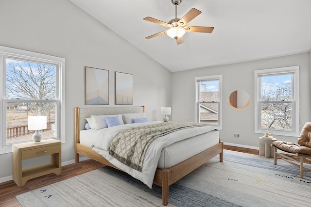 bedroom featuring hardwood / wood-style flooring, lofted ceiling, and ceiling fan