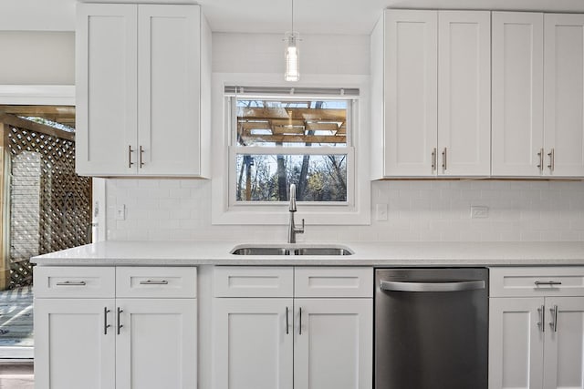 kitchen featuring white cabinetry, sink, and stainless steel dishwasher