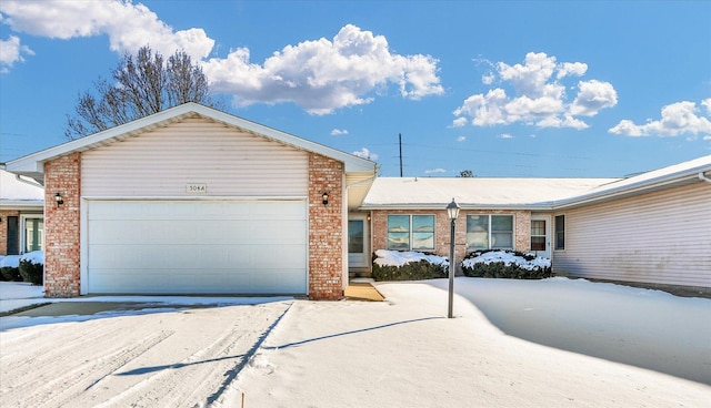 single story home with a garage