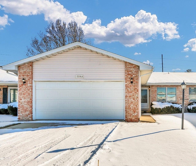 ranch-style house featuring a garage