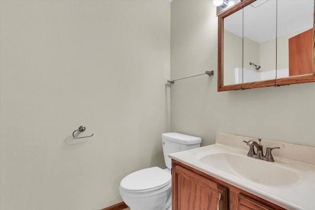 bathroom with toilet and vanity