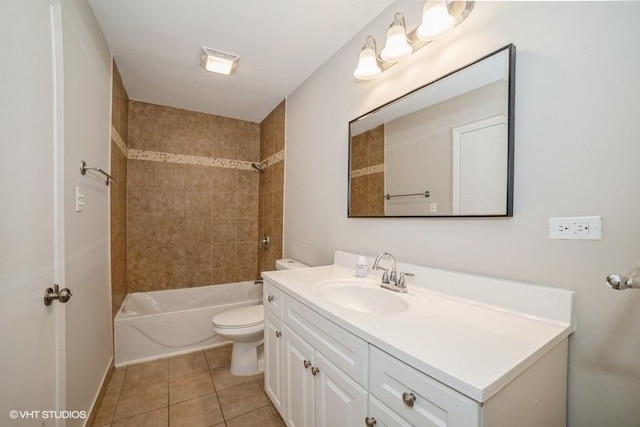 full bathroom with tile patterned flooring, vanity, toilet, and tiled shower / bath combo