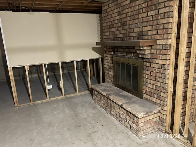 interior space with concrete flooring and a fireplace