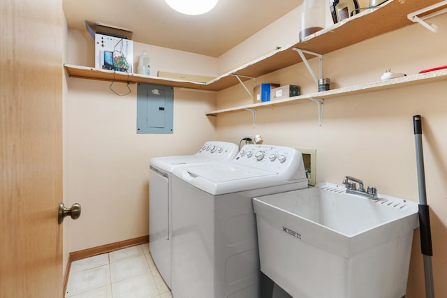 washroom with electric panel, sink, and washer and dryer