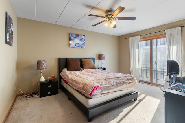 carpeted bedroom featuring access to outside and ceiling fan