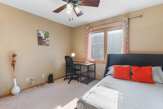 bedroom with light carpet and ceiling fan