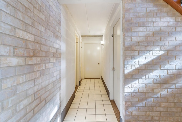 corridor featuring light tile patterned floors