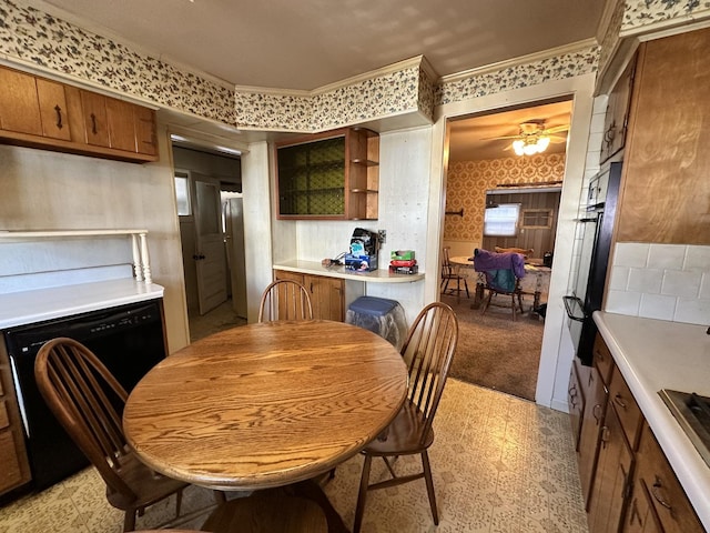 kitchen with ceiling fan, ornamental molding, and black dishwasher