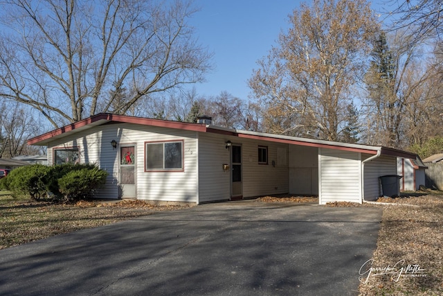 view of front of home with a carport