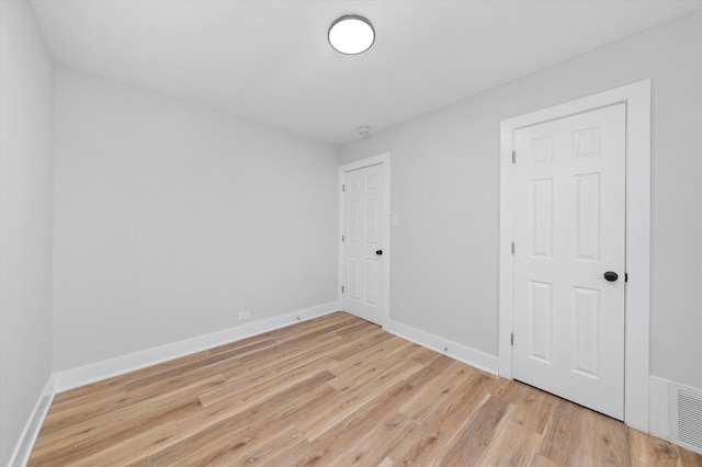 empty room with light wood-type flooring