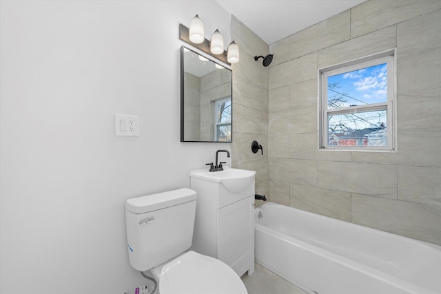 full bathroom with vanity, toilet, and tiled shower / bath