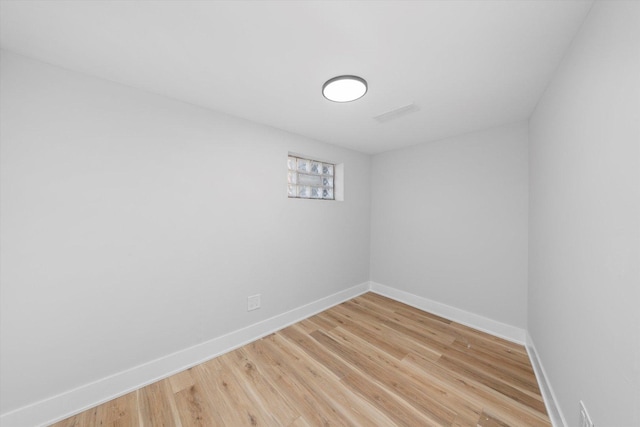 spare room featuring light hardwood / wood-style floors