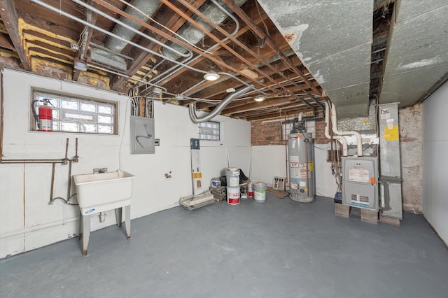 basement with electric panel, water heater, and heating unit