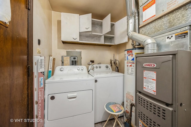 laundry area featuring washer and dryer, laundry area, and water heater