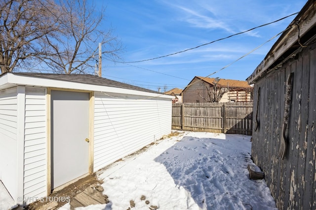 yard covered in snow with fence