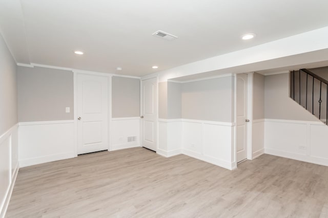 basement featuring light hardwood / wood-style floors