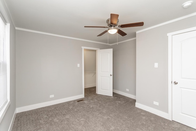 unfurnished bedroom featuring light carpet, ceiling fan, and ornamental molding