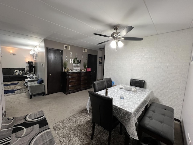 dining room featuring carpet and ceiling fan