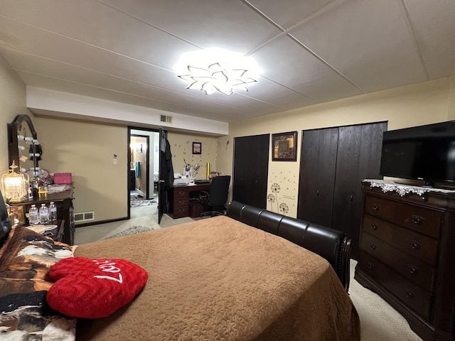 bedroom with light colored carpet