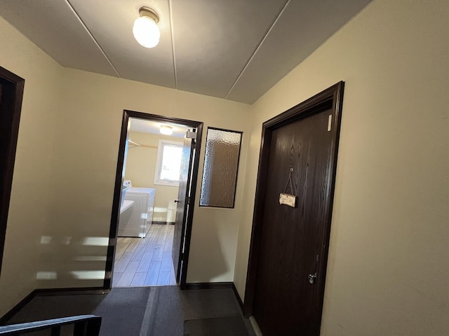 hallway featuring independent washer and dryer