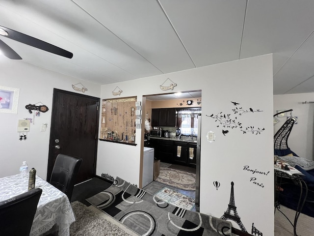 interior space with ceiling fan