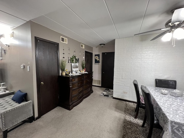 office area featuring light carpet and ceiling fan