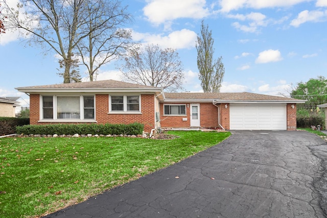 single story home with a front yard and a garage