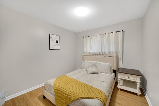 bedroom with wood-type flooring