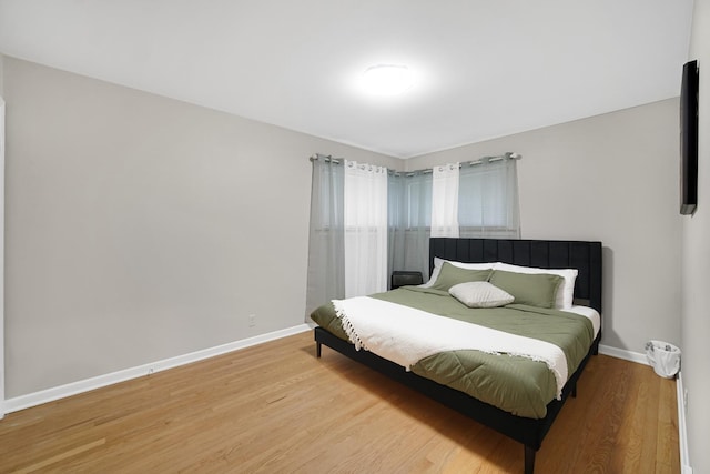 bedroom with light hardwood / wood-style floors