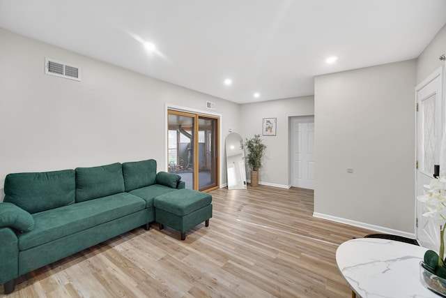 living room with light hardwood / wood-style floors