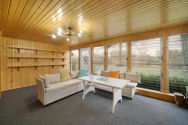 sunroom featuring an inviting chandelier, plenty of natural light, and wooden ceiling