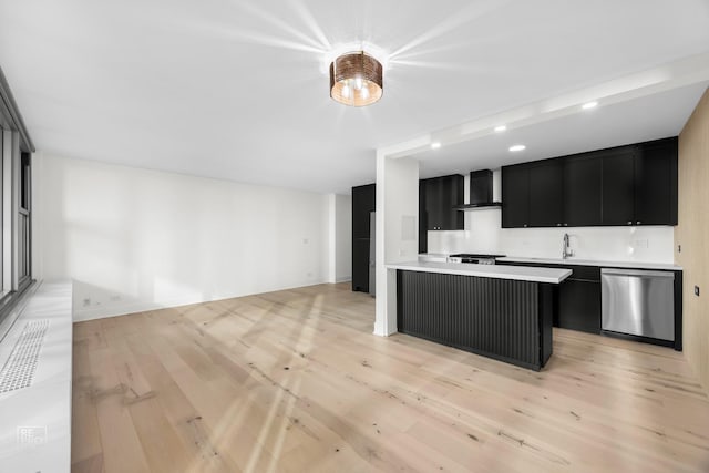 kitchen with stainless steel dishwasher, wall chimney exhaust hood, sink, and light hardwood / wood-style flooring