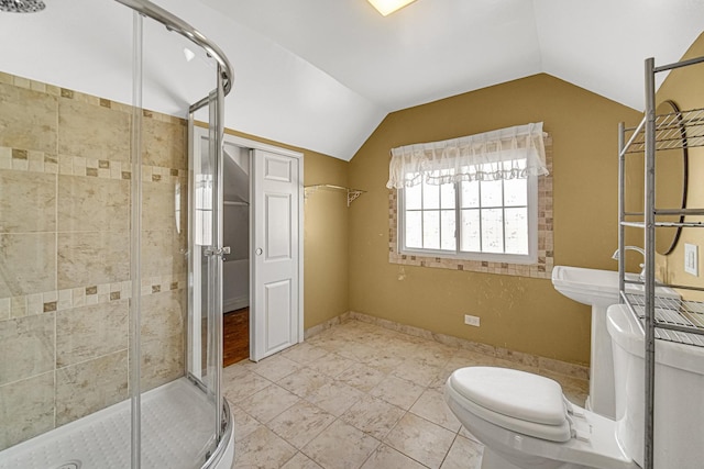 bathroom with toilet, walk in shower, and lofted ceiling