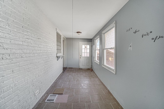 doorway with brick wall