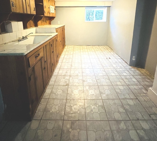 kitchen with tasteful backsplash and sink