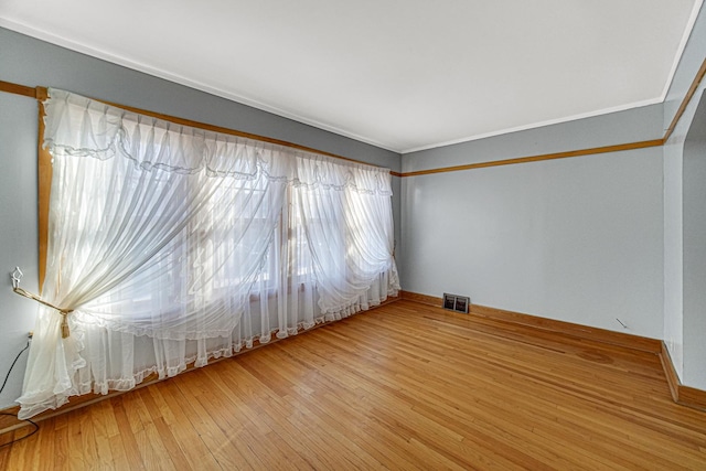 spare room with wood-type flooring