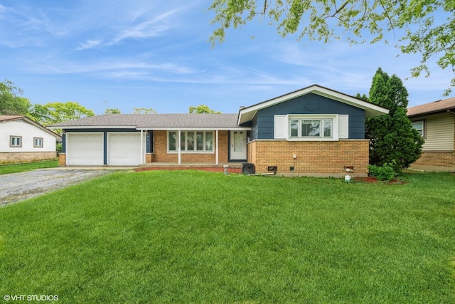 ranch-style home featuring a garage and a front lawn