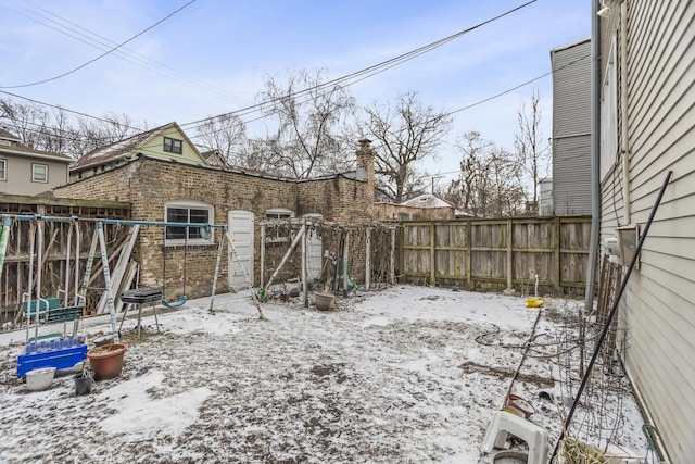 view of yard layered in snow