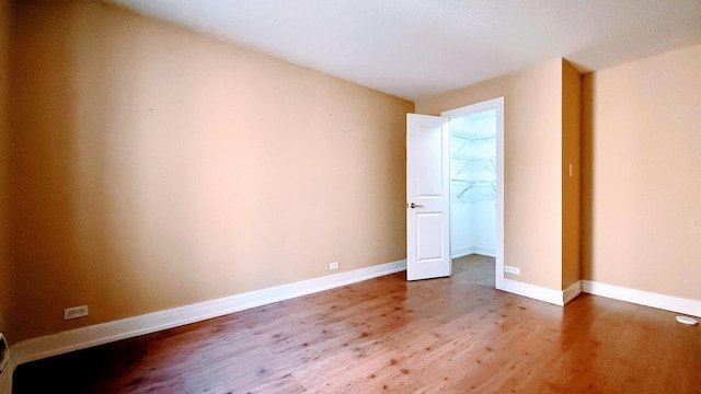 unfurnished bedroom with wood-type flooring