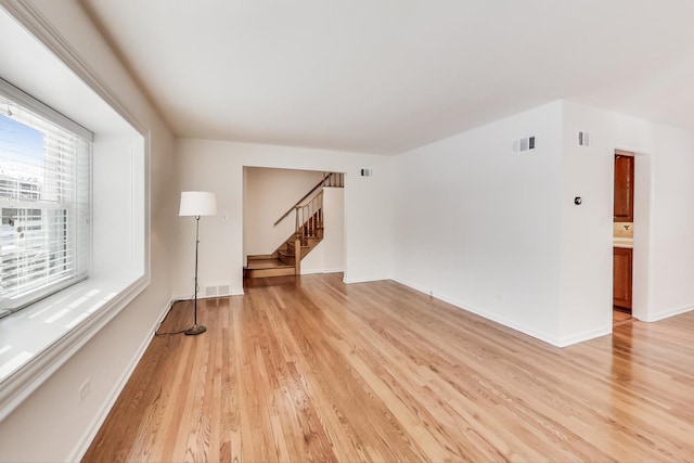 empty room with light hardwood / wood-style floors