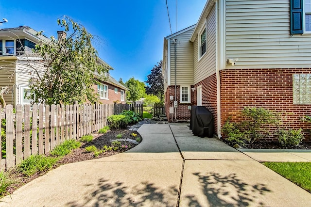 view of side of home with a patio