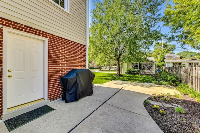 view of patio featuring a grill