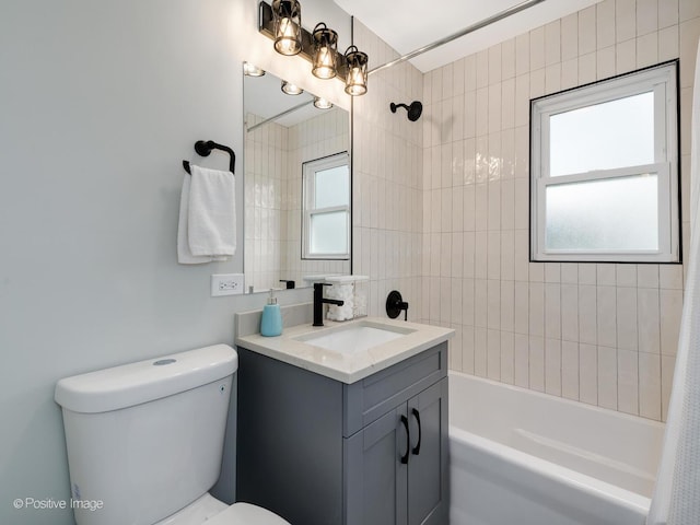 full bathroom featuring vanity, toilet, shower / bath combo with shower curtain, and a wealth of natural light