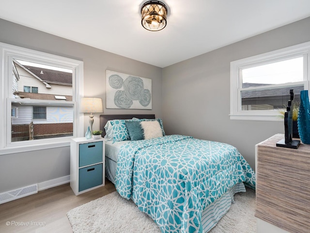 bedroom featuring wood-type flooring