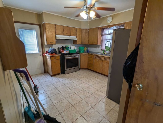 kitchen with appliances with stainless steel finishes, tasteful backsplash, ceiling fan, and sink