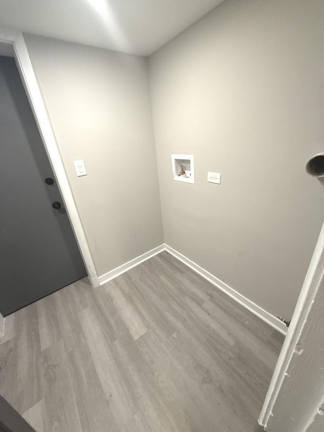 washroom featuring hardwood / wood-style flooring and hookup for a washing machine