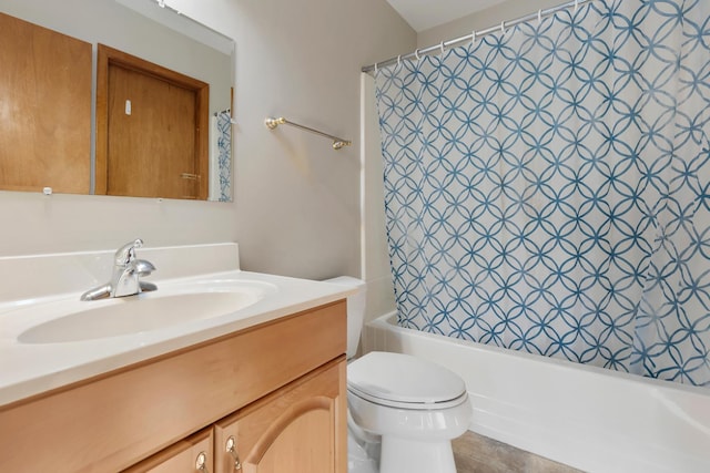 full bathroom featuring toilet, shower / bath combo, and vanity